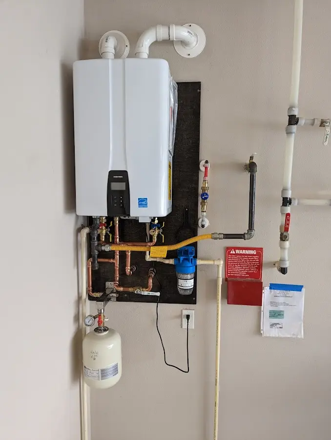 Professional plumber installing copper piping in a Shannon Hills home